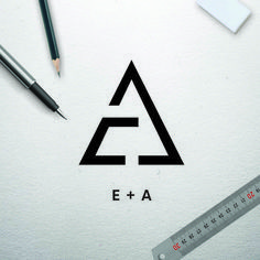 pencils, ruler and other office supplies on top of a white paper with the word e + a written in black