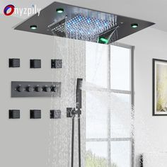 the shower head is open and has water running from it's sides, with green lights on each side