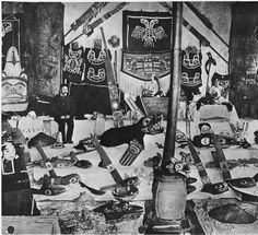 an old black and white photo with many items on the floor in front of it