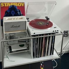 a record player sitting on top of a shelf