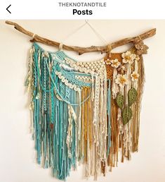 there is a wall hanging made out of beads and chains