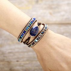 This stunning lapis lazuli black leather bracelet will be the perfect accessory to add a touch of personality to any outfit. Crafted from supple leather and adorned with faceted gemstone beads, this bracelet is sure to be an eye-catching focal point. Wear it alone or stack with other pieces to make a statement! Middle Stone: Sodalite Material: Sodalite, Crystal, Jasper, Metal, Leather Making Technics: Handmade Sewed Size: Women-50cm+3 closures; Men-53cm+3 closures Custom Service: Accept, please Gemstone Wrap Bracelet, Wrap Armband, Sodalite Crystal, Beaded Leather Wraps, Treasure Jewelry, Bracelet Apple Watch, Black Leather Bracelet, Blue Sodalite, Winter Beauty