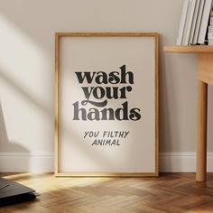 a black and white poster with the words wash your hands you filthy animal on it