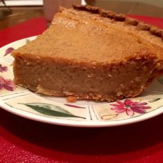 two slices of pie sitting on top of a white and red plate next to each other