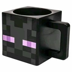 a black and purple minecraft coffee mug with an evil face on the front side