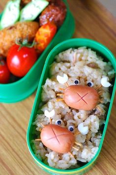 two plastic containers filled with food on top of a wooden table