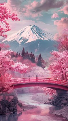 a red bridge over a river surrounded by pink trees and snow capped mountain in the background