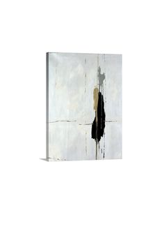 an abstract painting with black and white paint on the wall, including one large piece of art