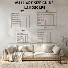 a living room with a couch and wall art on the wall next to it's measurements