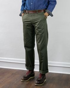 Introducing our high-quality 7.5 oz. Stretch Twill Officer Chino Trousers, a premium reproduction inspired by WWII military wear. Originating from China, these trousers were playfully dubbed "pantalones chinos" by American soldiers, adopting the Spanish term for "Chinese pants." By 1902, chinos were formally integrated into the official US Army uniform.The WWII-era service chinos prioritized mobility, boasting a high rise and wide leg for freedom of movement. In contrast, our Officer Chinos are Fitted Military Cotton Bottoms, Fitted Military Style Cotton Bottoms, Fitted Cotton Military Bottoms, Fitted Olive Pants For Spring, Spring Pants With Belt Loops And Standard Cut Leg, Fitted Olive Straight Leg Pants, Fitted Khaki Work Pants With Tapered Leg, Classic Relaxed Fit Green Chinos, Classic Green Relaxed Fit Chinos