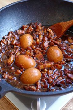 some food is cooking in a pan on the stove