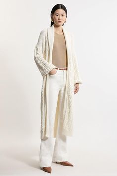 Petite All Over Cable Knit Shawl Collar Longline Belted Coatigan Elegant Knitted Long Sleeve Outerwear, Elegant Long Knit Outerwear, Elegant Long Sleeve Knitted Outerwear, Cashmere Cable Knit Sweater Coat, Elegant Beige Knit Outerwear, Cream Wool Long Sleeve Sweater Coat, Beige Long Cable Knit Outerwear, Elegant Knitted Sweater Coat For Spring, Elegant Cream Cable Knit Cardigan