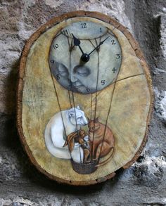 a clock with two cats and a dog on it's face sitting on a tree stump