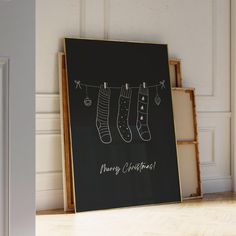 a black board with christmas stockings hanging from it