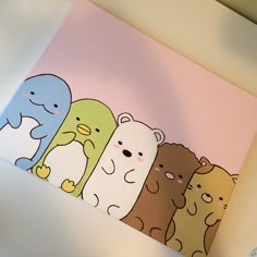 a group of bears standing next to each other on top of a white tablecloth