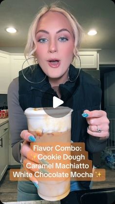 a woman holding a drink in her hand with the words flavor combo cookie dough and caramel machato white chocolate mocha