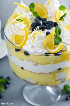 a trifle with lemons, blueberries and whipped cream