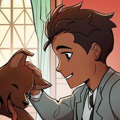 a young man petting a dog in front of a window