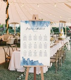 an outdoor seating area with tables and chairs under a tent for guests to sit at