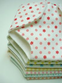 four cloths stacked on top of each other with pink and white polka dot designs