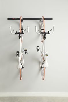 Rubbermaid FastTrack bike kit is a great way to organize your bikes within the garage. Get bikes off the floor and onto the wall, creating more space to work and play. Rubbermaid FastTrack Garage 3-Piece Black and Satin Nickel Steel Bike Rack | 2087463 Bike Rack Apartment, Apartment Bike Storage, Bike Garage Storage, Garage Organization Bikes, Bike Storage Flat, Bike Storage Garage Wall, Bike Wall Mount Apartment, Bike Storage Small Space, Garage Bike Storage