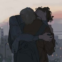 two people hugging each other in front of a sunset