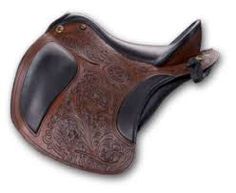 a brown and black saddle on a white background