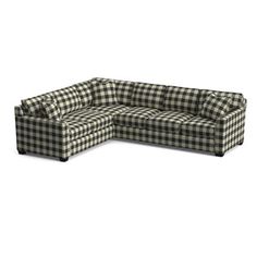 a black and white checkered sectional couch with the seat facing outward in front of it