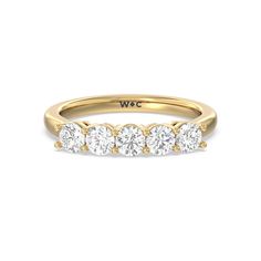 three stone diamond ring in yellow gold