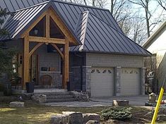 a house with a metal roof and stone steps