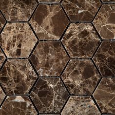 an image of marble tiles that look like hexagonals in brown and white