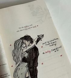 an open book with a drawing of a man and woman kissing on the foreheads