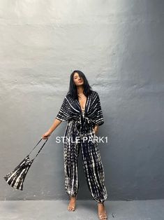 Chic Tie Waist Loungewear Sets, Chic Loungewear Sets With Tie Waist, Summer Matching Short Sleeve Pant Set, Summer Short Sleeve Matching Pant Set, Chic Wide Leg Sets For Beach, Cotton V-neck Sets For Day Out, Chic Matching Pant Set For Vacation, Chic Vacation Pant Set, Casual Summer Maxi Length Sets