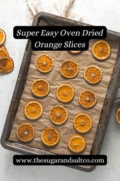 orange slices on a baking sheet with the words, super easy oven dried orange slices