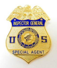 a gold police badge with the words us special agent in blue and white on it