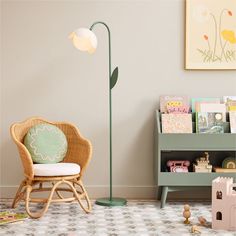 a child's room with a chair, bookshelf and toys on the floor