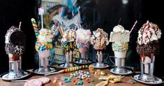 an assortment of ice cream sundaes on display