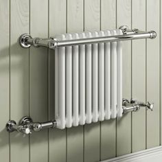 a white radiator mounted to the side of a wall