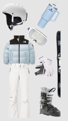 an assortment of snow gear including skis, gloves and water bottle are shown in this image