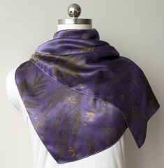 ◦ This silk scarf was eco dyed with logwood chips, Grevillea and Eucalyptus leaves and flowers. ◦ Made from natural silk satin fabric, it has soft luster, is light, and drapes beautifully. ◦ Size: 40cm x 140cm.   Machine hemmed. ◦ This elegant accessory would be a great gift for a Nature loving person. ◦ Color scheme: dark purple background with soft yellow and khaki green colors which were achieved by a combination of natural logwood dye, tannins and pigments containing in the leaves and flowers.  ◦ I did my best to ensure that all stages of the process and materials used were environmentally friendly.     ◦ Natural silk fabric acts as a heat regulator, keeping body warm in winter and cool in summer. ◦ Care instructions for Eco printed silk scarf: -Hand wash in cold or warm water with PH Logwood Dye, Purple Silk Scarf, Dark Purple Background, Luxury Silk Scarves, Summer Care, Leaf Scarf, Green Leaf Print, Silk Satin Fabric, Silk Set