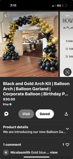 the balloon arch is in black and gold