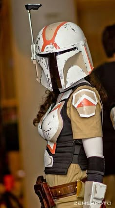 a woman is dressed up as star wars character boba fett from the force awake