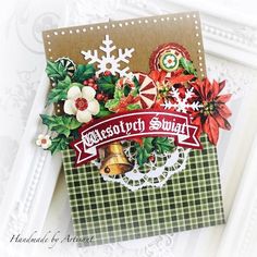 a close up of a christmas card with snowflakes and bells on the front