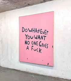 a pink sign that says do whatever you want, no one gives a f k