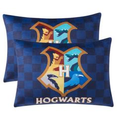 two harry potter pillow cases with hogwart's crests on the front and back