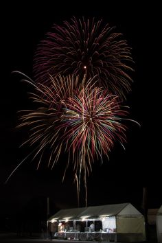 fireworks are lit up in the night sky