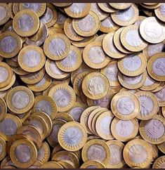 a pile of different types of coins