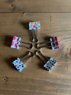 six pieces of cake cutters sitting on top of a wooden table