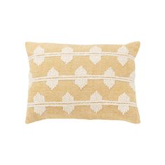 a yellow and white pillow with leaves on the front, sitting on a white background