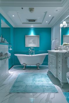 a bathroom with blue and white walls, a bathtub in the center and a rug on the floor